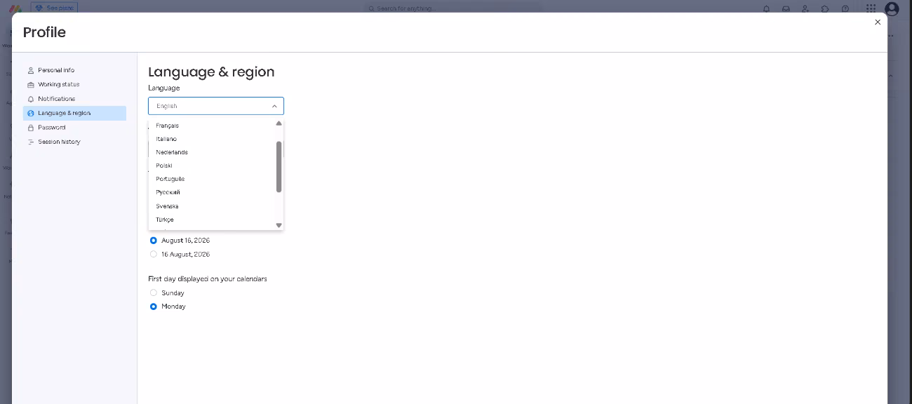 monday.com profile settings with the language and region list open